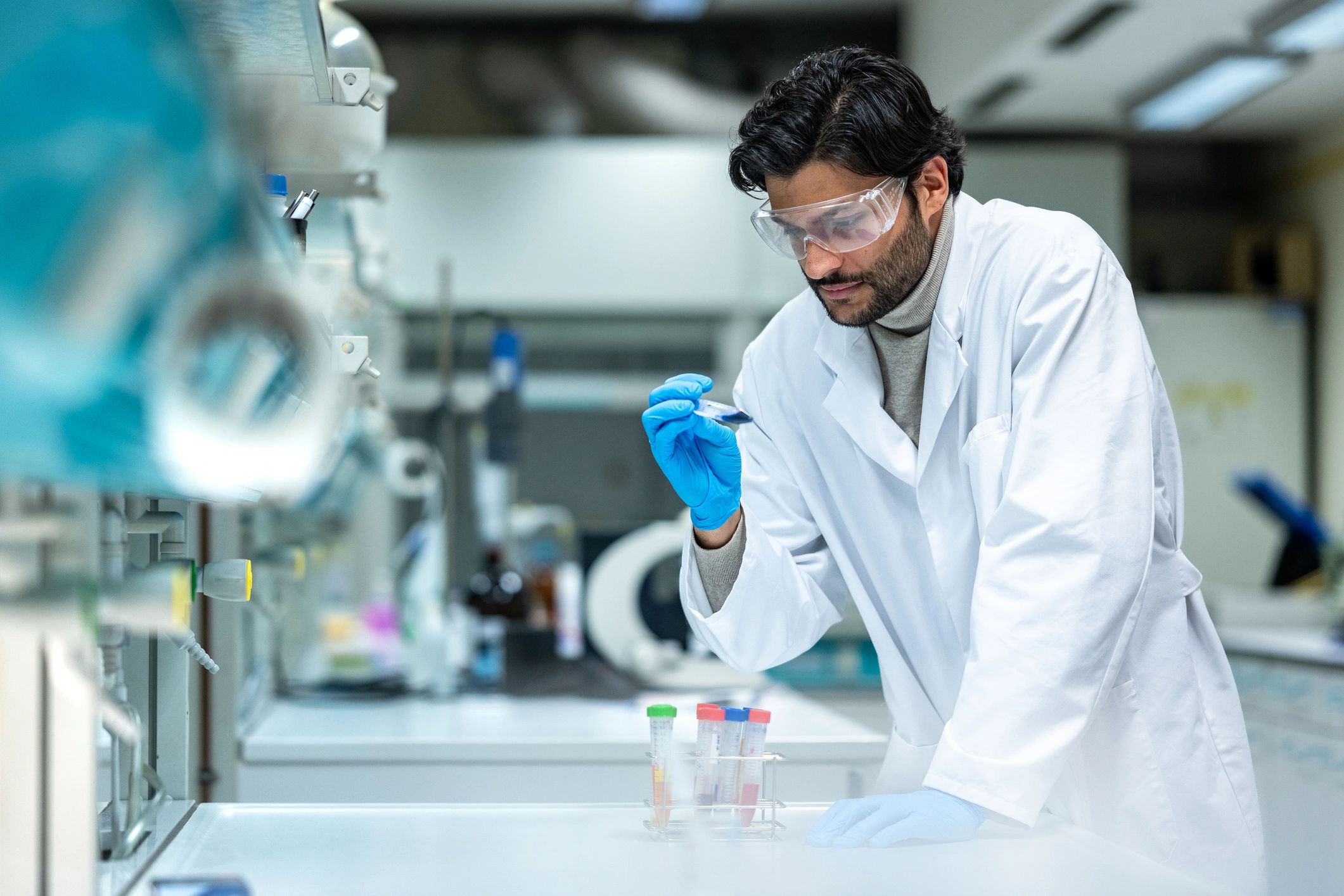 Scientist handling a sample in a modern laboratory